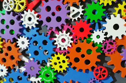 A colorful arrangement of gears symbolizing creativity, innovation, and machinery in vibrant colors.